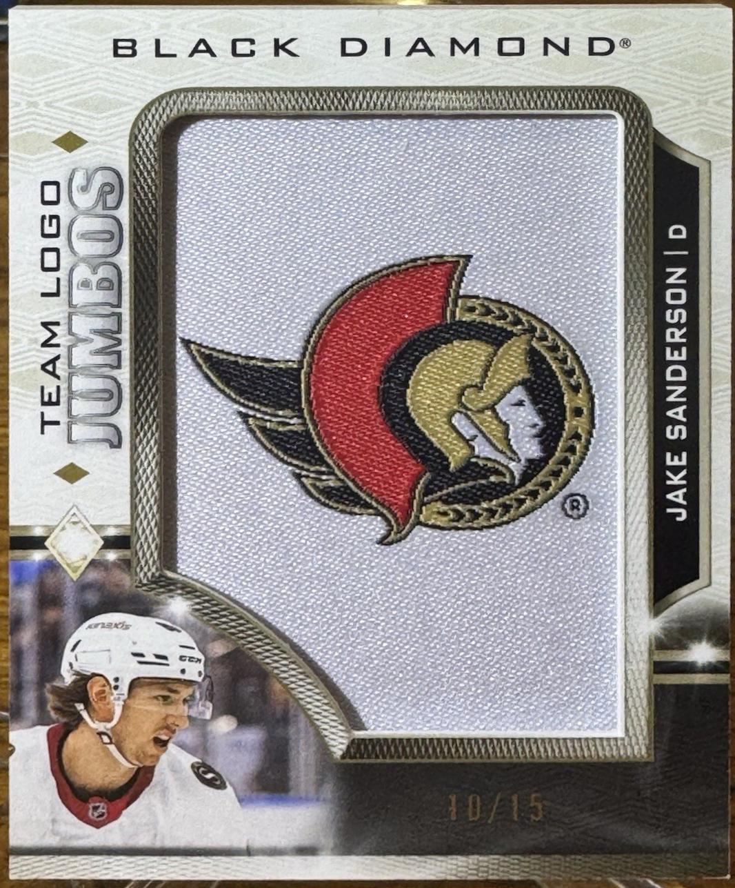 Jake Sanderson [Team Logo Gold] #TL-JA