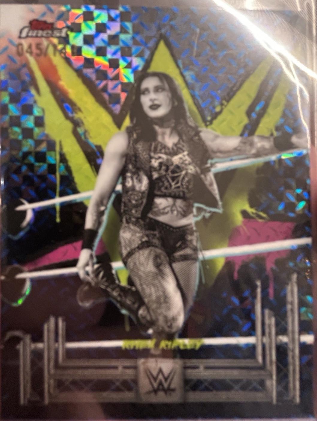 Rhea Ripley [Blue Checkerboard Refractor] #60